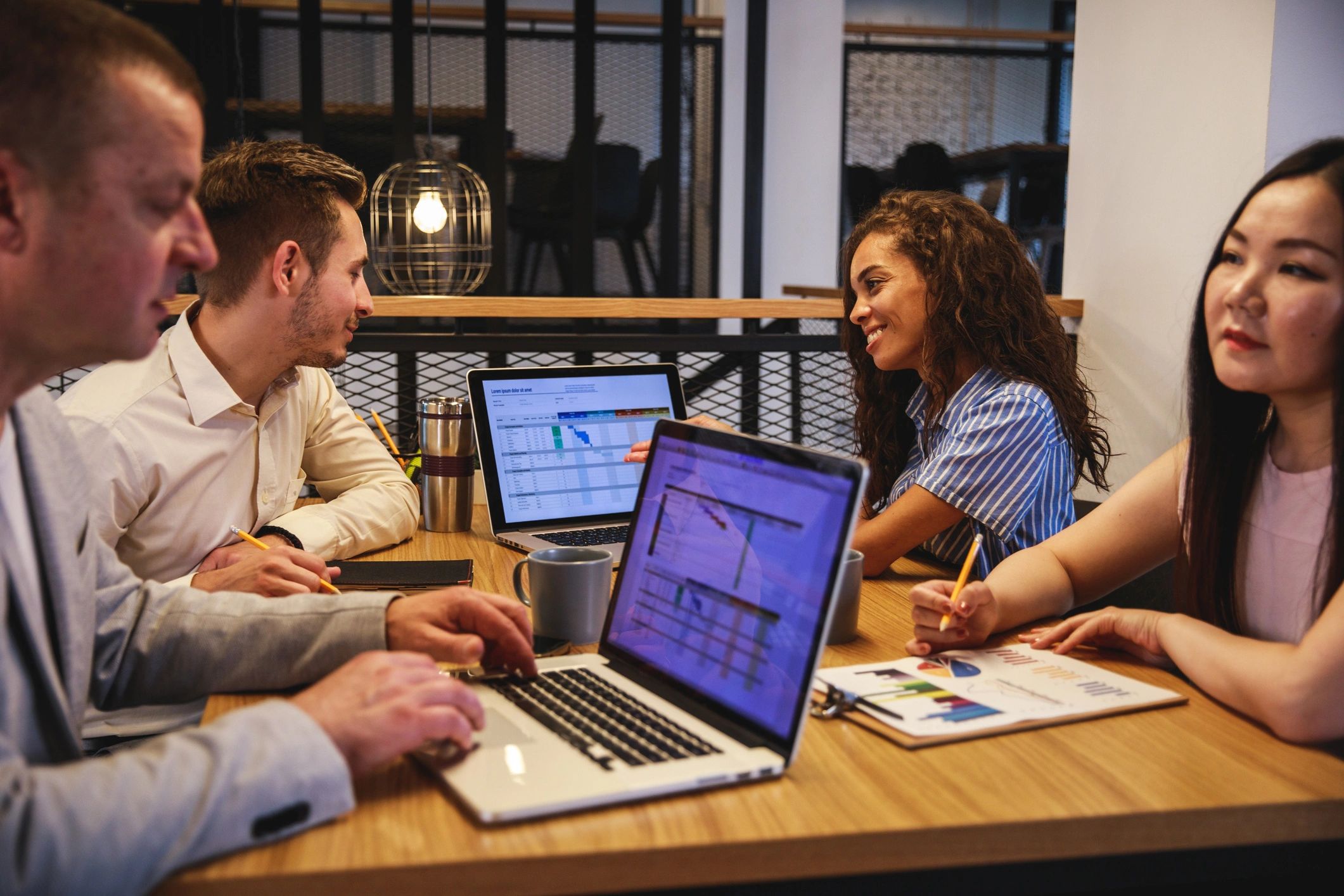 Business team discussing digital project strategy in a modern boardroom