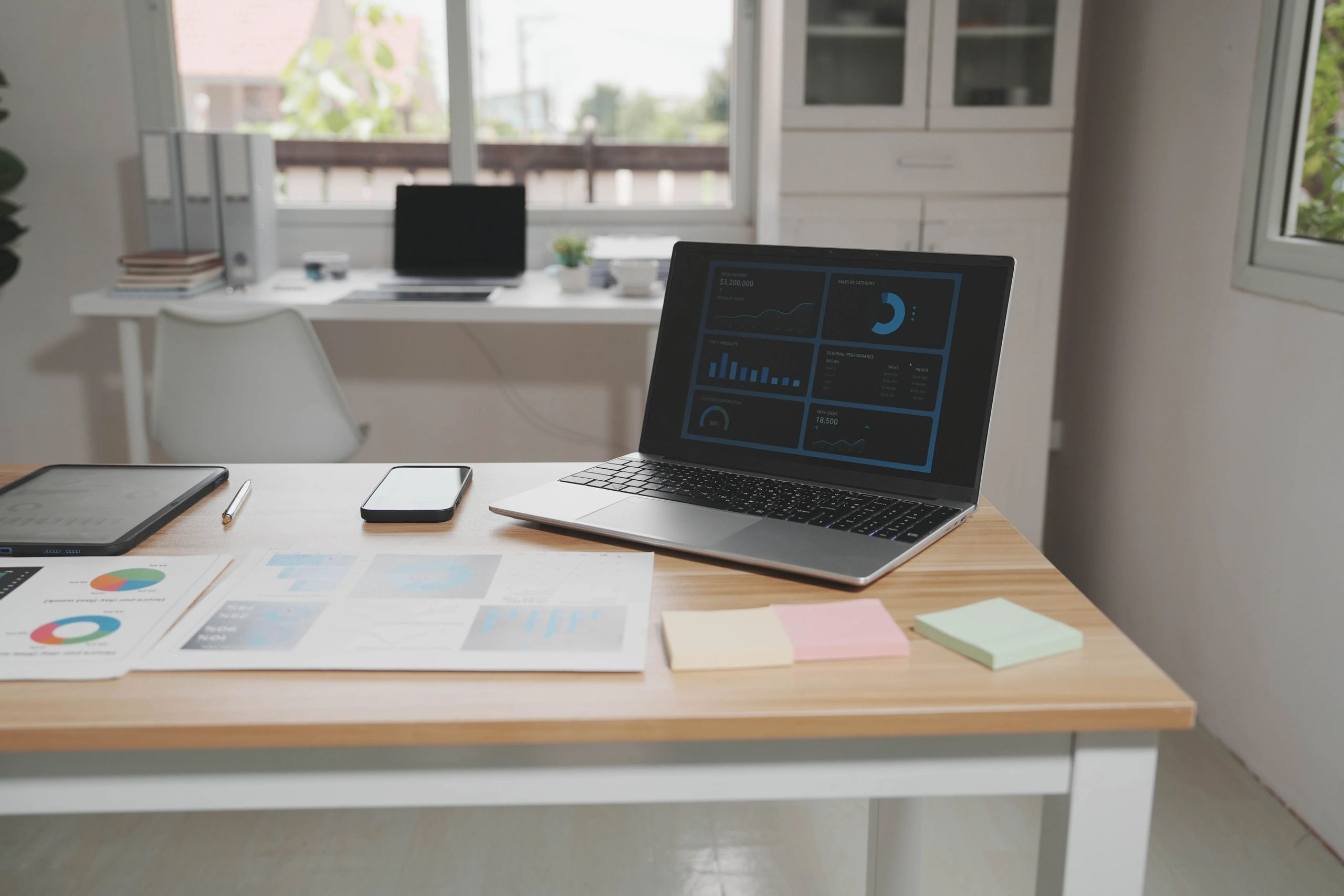 Laptop dashboard and planning workspace representing local visibility and profile optimization
